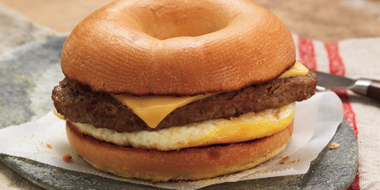 Dunkin’ Donuts Angus Steak & Egg Breakfast sandwich on a table.