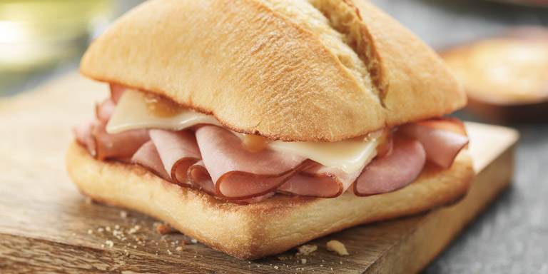 Dunkin’ Donuts Ham & Cheese Flatbread sandwich on a table.