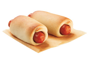 Two Dunkin’ Donuts Kolache sandwiches on a tan napkin.